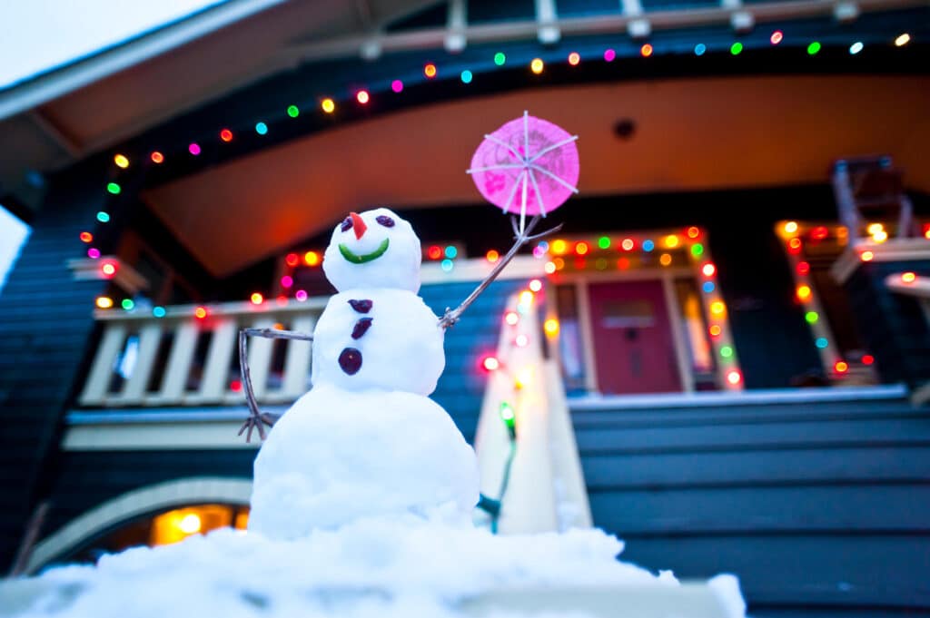 A smiling snowman demonstrating the possibility of relaxation and calm in the holiday season