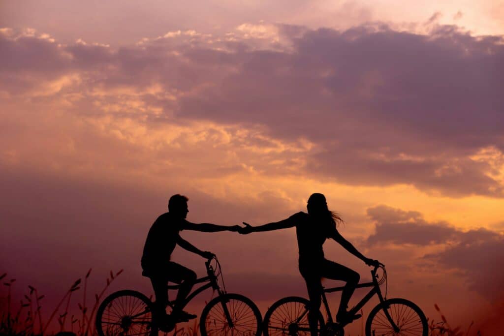 a happy, connected couple on bikes